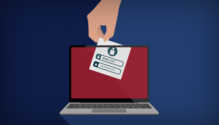 En hånd stjæler konto oplysninger fra en computer